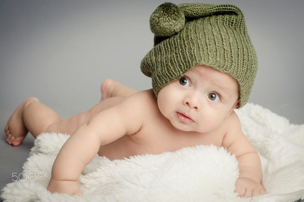 cute newborn baby boy smiling