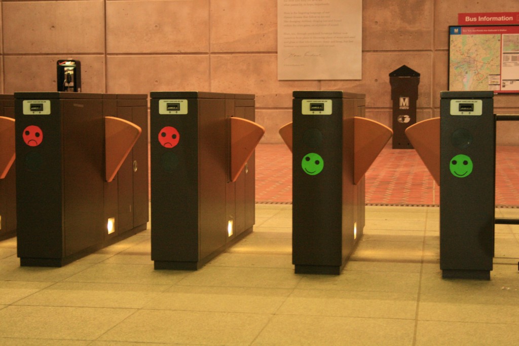 Ticket booths with smiley faces in subway