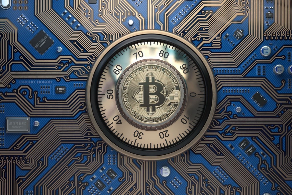 Bitcoin logo embedded onto a safe lock.