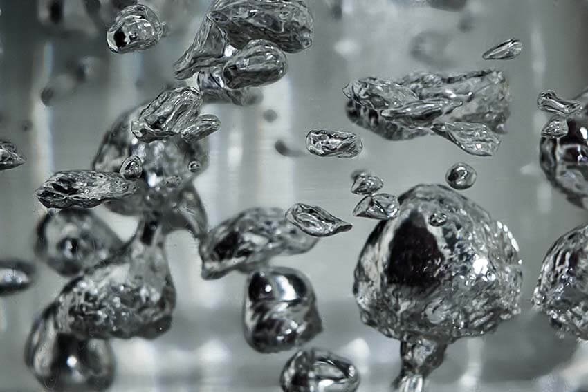 Mercury Liquid Metal Details Reference Image Drops and bubbles of mercury in water. Dangerous chemical element, the scientific experience.