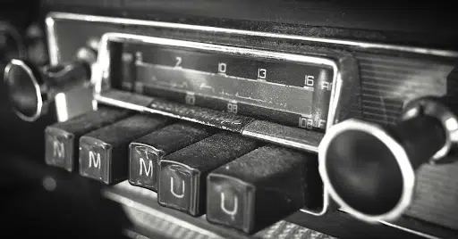 Old radio with one button pressed in.