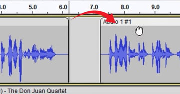 User splitting audio tracks for Audacity podcast editing.