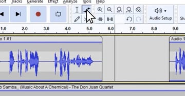User clicking envelope tool button for Audacity music editing tutorial.