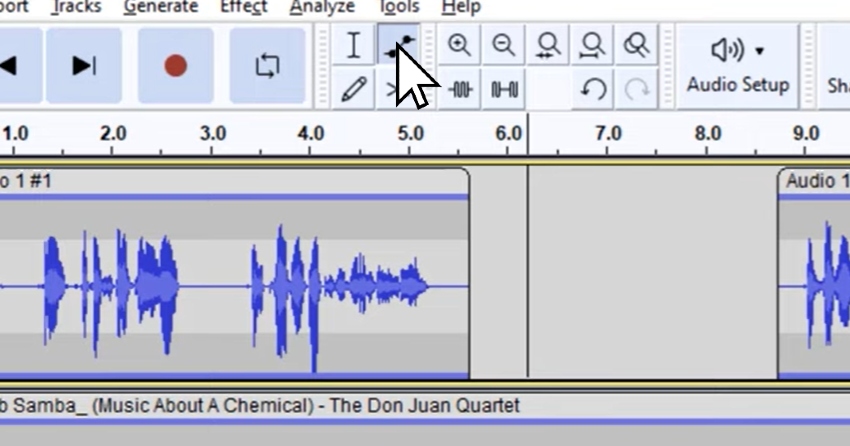 User clicking envelope tool button for Audacity music editing tutorial.
