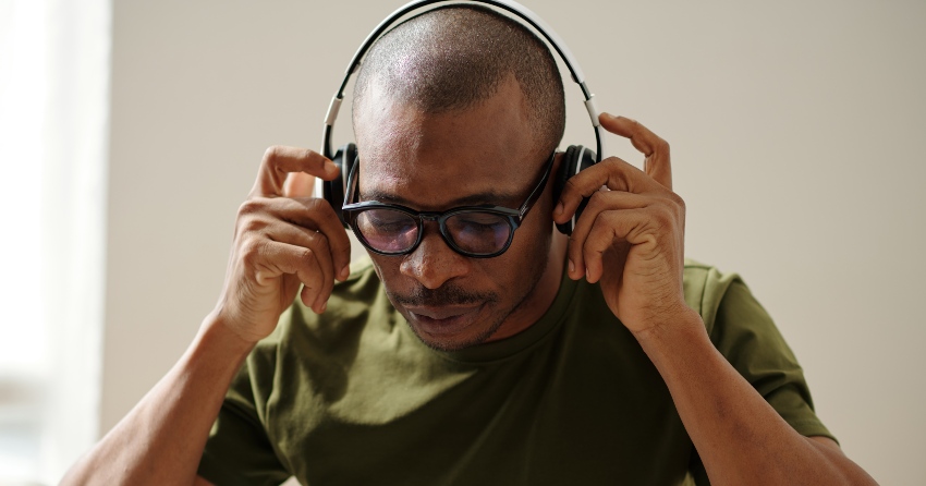 Guy With Head Phones Listening To Tracks