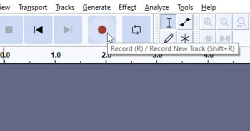 User clicking record button to start recording for Audacity music editing tutorial.