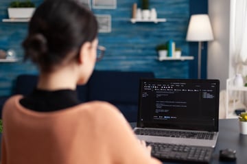 Freelancer programming software on laptop
