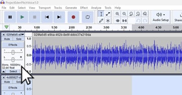 User pointing to volume sliders for article on how to clean up audio with Audacity.
