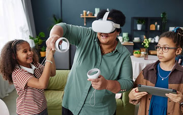 Woman Playing VR Game with Two Girls