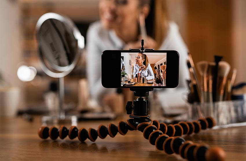 Close-up of make-up artist recording video tutorial about beauty products