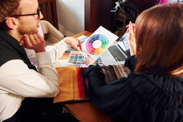 Two people working on a color palette