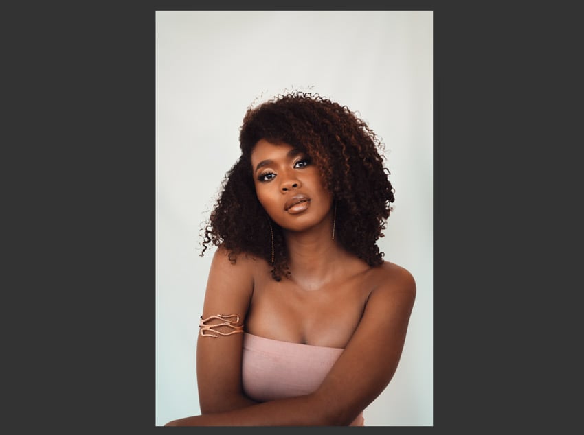 How to smooth a background in Photoshop: blur added.